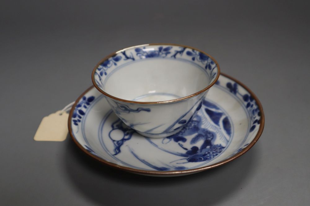 A Chinese Kangxi blue and white leaping carp tea bowl and saucer, 13cm diameter